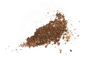 Brown face powder isolated on brown background.