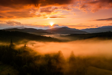 Misty dawn in the mountains. Beautiful landscape