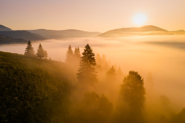 Fototapeta na wymiar Misty dawn in the mountains. Beautiful landscape