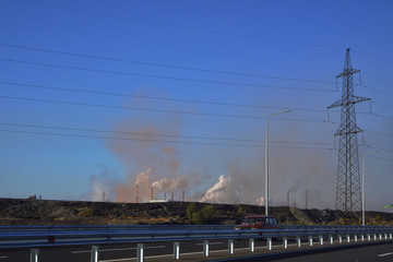 Plant with smoke. Air pollution.
