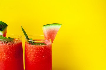 Vitamin watermelon smoothie for vegans on a yellow background. Super food for detox