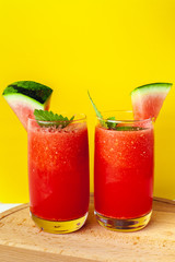 Vitamin watermelon smoothie for vegans on a yellow background. Super food for detox