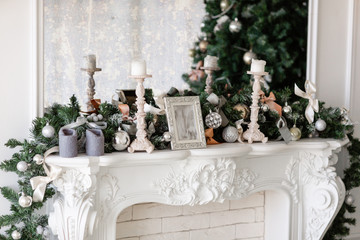 Christmas morning. classic luxury apartments with a white fireplace, decorated christmas tree. Holiday card.