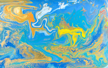 Fototapeta na wymiar Blue and yellow marble pattern with golden glitter. Abstract liquid background