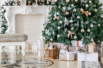 Christmas morning. classic luxury apartments with a white fireplace, decorated christmas tree. Holiday card.