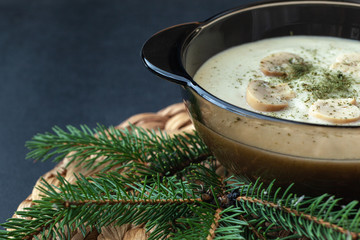Mushroom Cream Vegetarian Soup on a dark background. Close up.