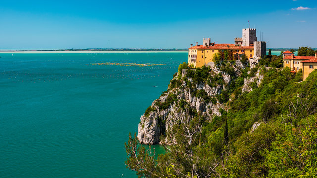 Gulf of Trieste. High cliffs Between boats, karst rocks and ancient castles. Duino. Italy