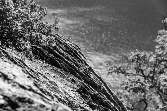 Gulf of Trieste. High cliffs Between boats, karst rocks and ancient castles. Black and white. Duino. Italy