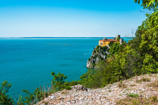 Gulf of Trieste. High cliffs Between boats, karst rocks and ancient castles. Duino. Italy