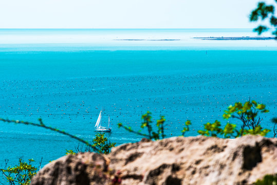 Gulf of Trieste. High cliffs Between boats, karst rocks and ancient castles. Duino. Italy