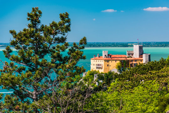 Gulf of Trieste. High cliffs Between boats, karst rocks and ancient castles. Duino. Italy