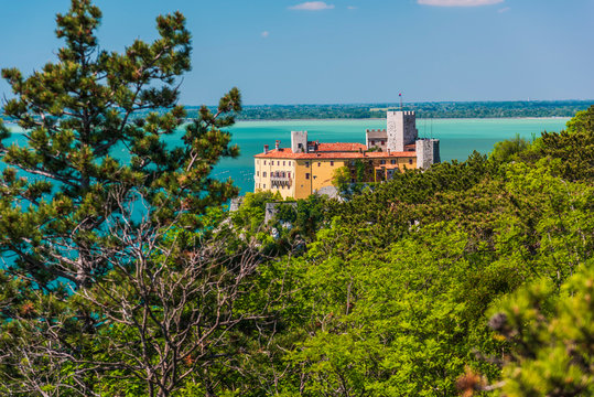 Gulf of Trieste. High cliffs Between boats, karst rocks and ancient castles. Duino. Italy