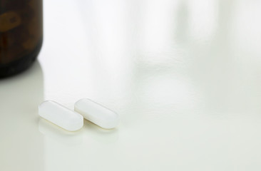 Closeup of paracetamol pills on white table