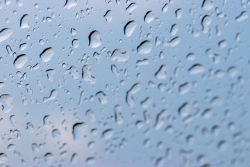 Abstract of Rain drops on window glass, natural water pattern background , selective focus.
