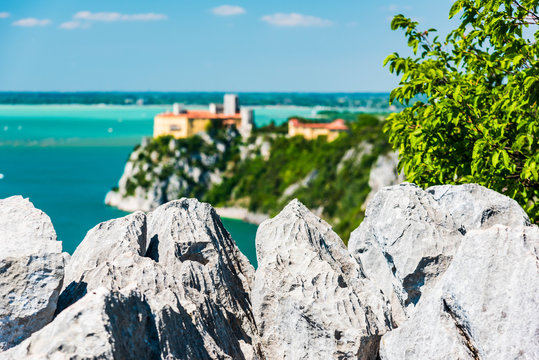 Gulf of Trieste. High cliffs Between boats, karst rocks and ancient castles. Duino. Italy