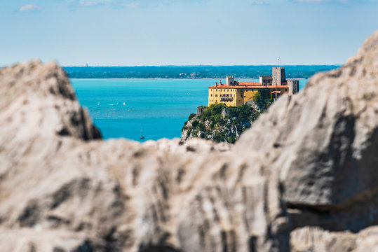 Gulf of Trieste. High cliffs Between boats, karst rocks and ancient castles. Duino. Italy