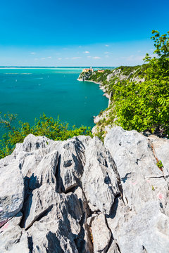 Gulf of Trieste. High cliffs Between boats, karst rocks and ancient castles. Duino. Italy