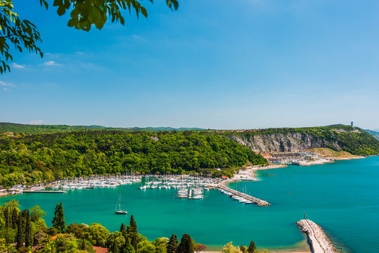 Gulf of Trieste. High cliffs Between boats, karst rocks and ancient castles. Duino. Italy