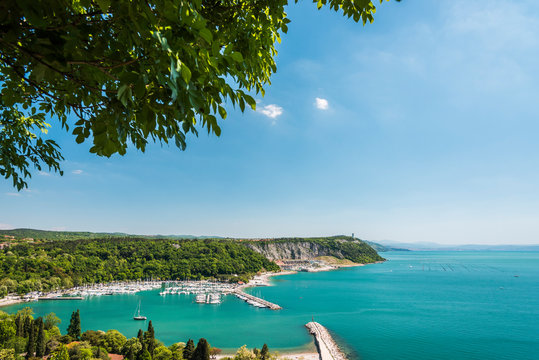 Gulf of Trieste. High cliffs Between boats, karst rocks and ancient castles. Duino. Italy