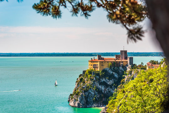 Gulf of Trieste. High cliffs Between boats, karst rocks and ancient castles. Duino. Italy