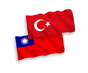 National vector fabric wave flags of Turkey and Taiwan isolated on white background. 1 to 2 proportion.