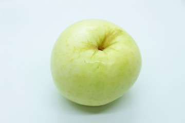 Green apple located on a white background