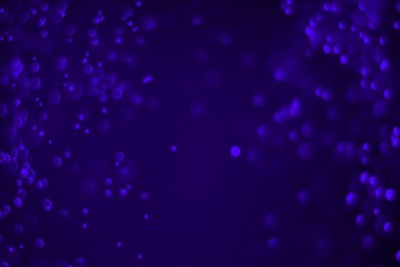 purple huge amount flying multi colored glitters bokeh texture - cute abstract photo background