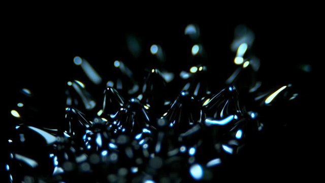Super Slow Motion Macro Shot of Magnetic Liquid Ferrofluid in Motion at 1000fps. Shooted with High Speed Cinema Camera at 4K.