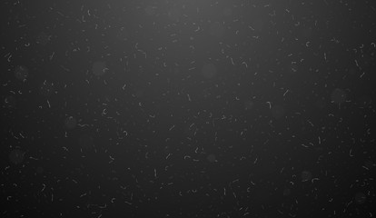 Macro dust particles flying over black background. Abstract white dust particles in the air. Abstract dust overlay texture.