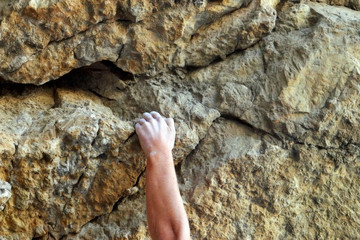 Climber's hands close-up. Mountain climbing elements.