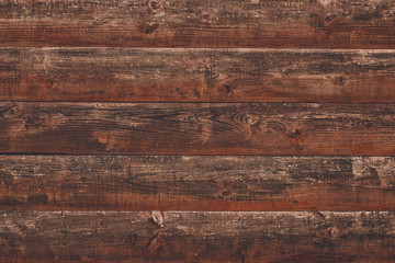 Shabby dilapidated log, rough wood background. Horizontal lines on wooden fence. Vintage rustic pattern of brown desk. Timber planks, scratched surface. Dirty wall backdrop, grunge texture.