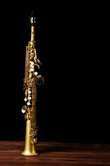 Fototapeta na wymiar soprano saxophone on black background