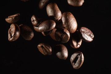 close up Flying coffee beans isolated on black background