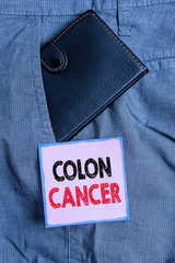 Handwriting text writing Colon Cancer. Conceptual photo the development of cancer cells from the...