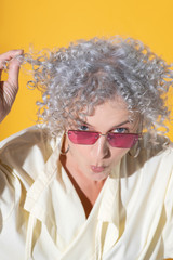 Woman making funny face while posing in photoshoot