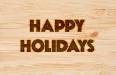 Happy Holidays Background. Burned in wood