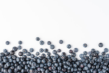 Overhead shot of tasty blueberries on white background with copyspace. Top view