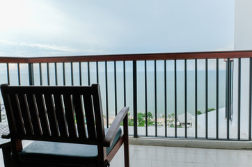 Fototapeta na wymiar Terrace sea view ,Sea view balcony with empty wood chair