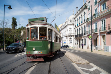 Fototapeta na wymiar Vintage green tram at Bairro Alto neighborhood, Lisbon, 