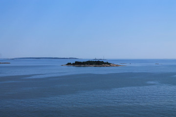 A small uninhabited island in the Baltic Sea off the coast of Finland. Seascape.