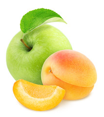 Apple with cutted apricot isolated on a white background.