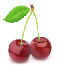 Whole and halved cherries isolated on a white.