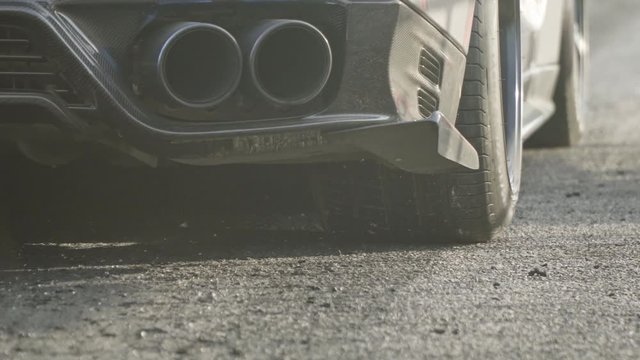 supercar drag race at starting line in race track