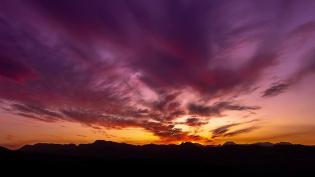 Sunset motion time lapse with mountain silhouettes and beautiful purple orange colors, movement is done with gimbal, filmed in Ronda, Malaga, Spain amazing 4k footage