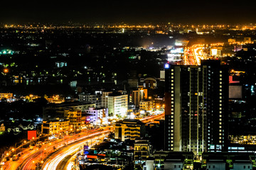 Fototapeta na wymiar Top view and wide angle of city scape with car light trail , night scene