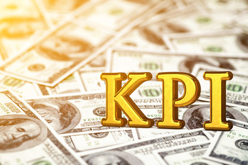 Concept gold abbreviation of KPI - Key Perfomance Indicator standing or lying on banknotes background. 3D Render.