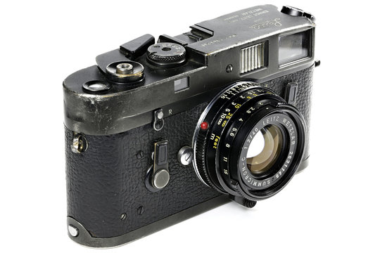 GERMANY - MAY 25, 2019: Heavy used Leica M4 camera isolated on white background. The Leica M4 is a 35 mm rangefinder camera produced by Ernst Leitz GmbH from 1966 - 1975.