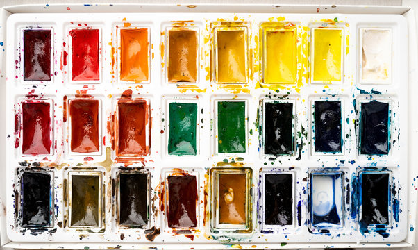 Set watercolor paints with paintbrush. Art concept