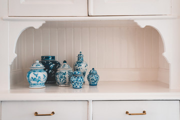 Pots in cupboard in kitchen