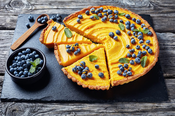 sweet pumpkin pie decorated with fresh berries